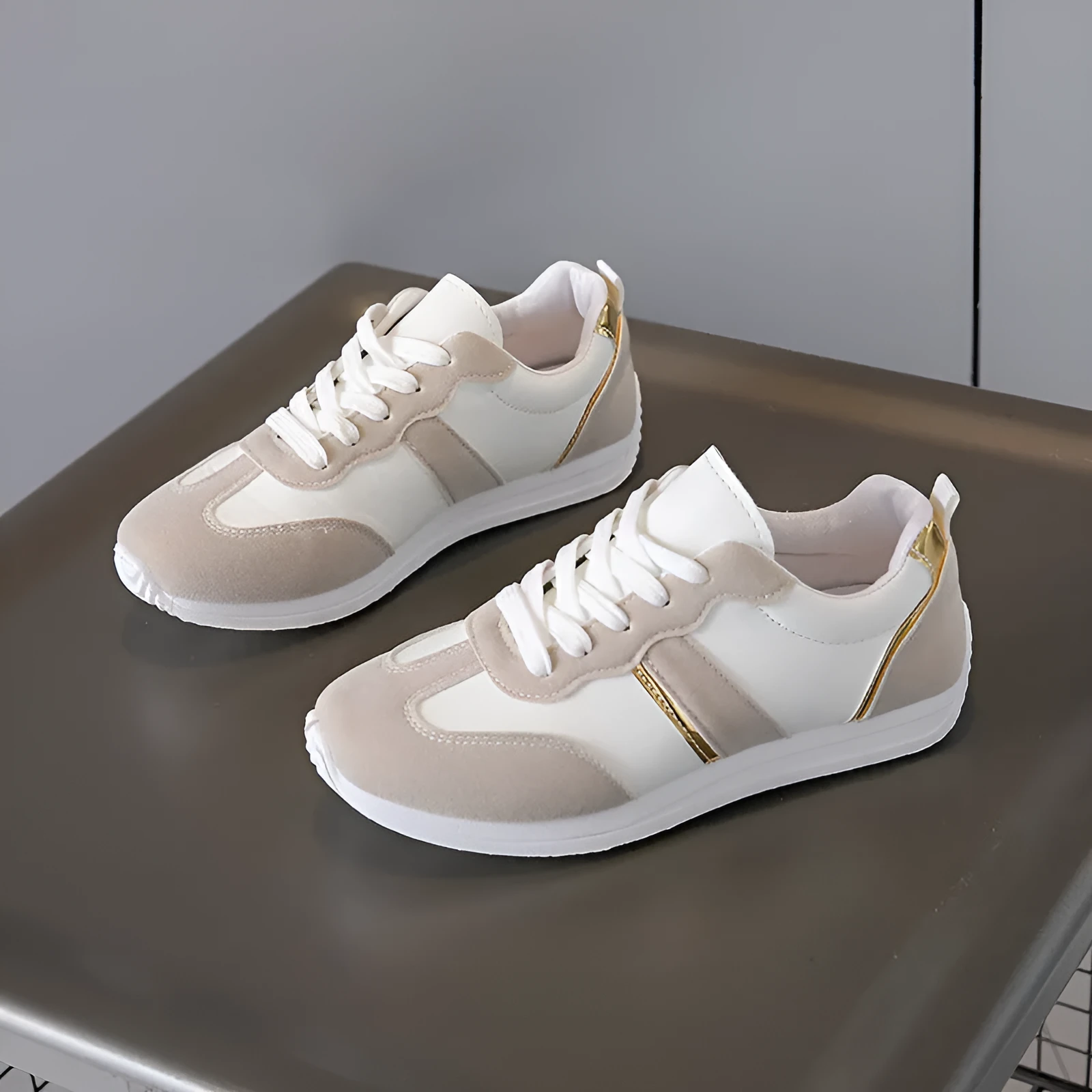 Women's casual flat sports shoes in grey with fabric canvas upper and PVC sole, low-top design