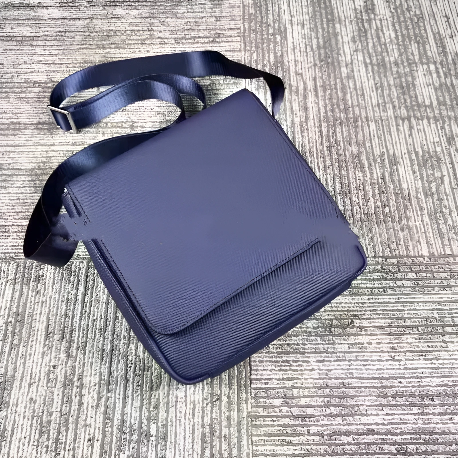 Men's leather horizontal square backpack in black with cover opening and internal organiser pockets