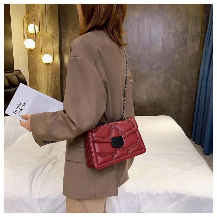 Small square PU shoulder bag with gold rivet studs, chain handle and zipper closure, available in four colours