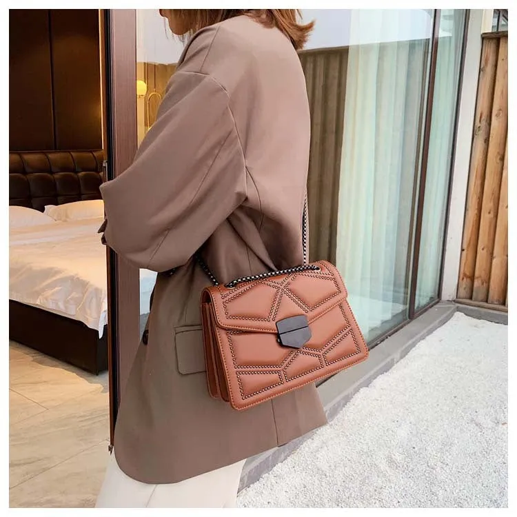 Small square PU shoulder bag with gold rivet studs, chain handle and zipper closure, available in four colours