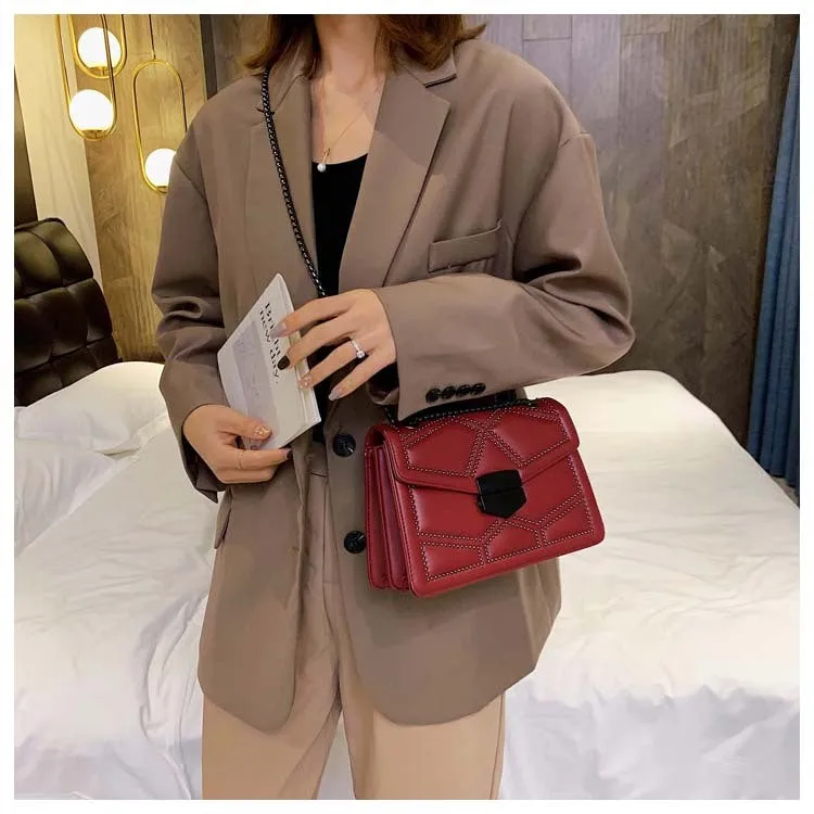 Small square PU shoulder bag with gold rivet studs, chain handle and zipper closure, available in four colours