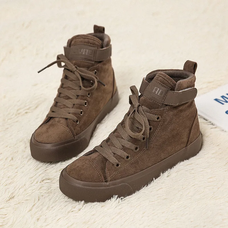 Women's high-top canvas shoes with velcro strap, black colour, rubber sole on a plain background