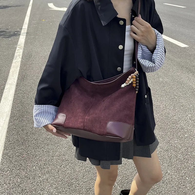 Women's PU leather retro shoulder crossbody bag in brown with ribbon pendant, horizontal shape, sandwich pocket