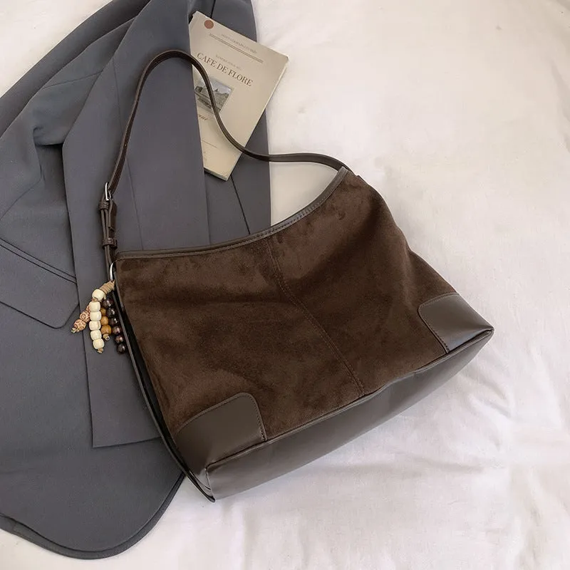 Women's PU leather retro shoulder crossbody bag in brown with ribbon pendant, horizontal shape, sandwich pocket