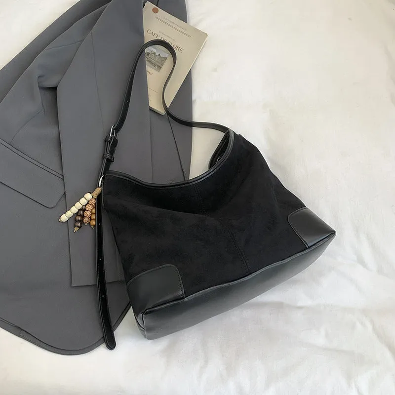 Women's PU leather retro shoulder crossbody bag in brown with ribbon pendant, horizontal shape, sandwich pocket