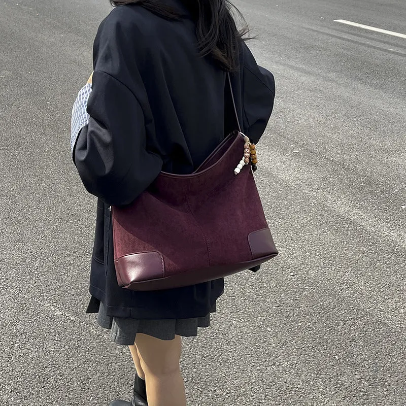 Women's PU leather retro shoulder crossbody bag in brown with ribbon pendant, horizontal shape, sandwich pocket