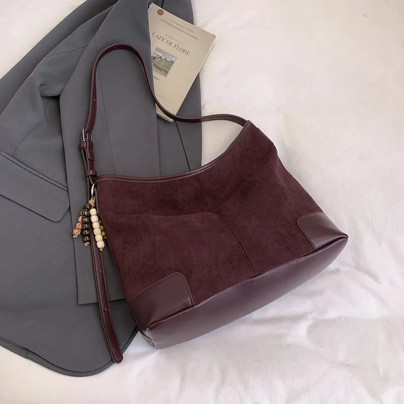 Women's PU leather retro shoulder crossbody bag in brown with ribbon pendant, horizontal shape, sandwich pocket