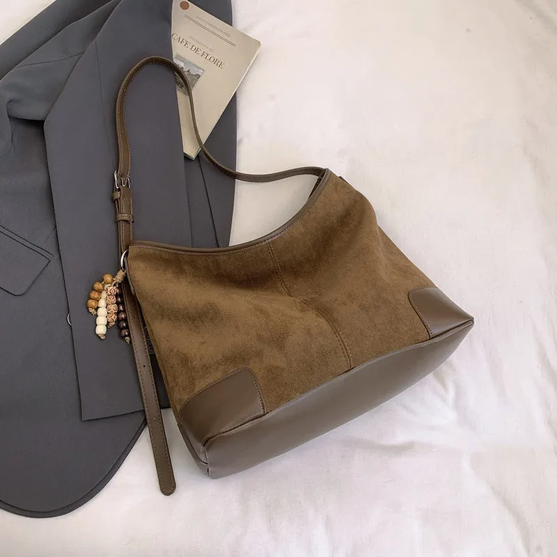 Women's PU leather retro shoulder crossbody bag in brown with ribbon pendant, horizontal shape, sandwich pocket
