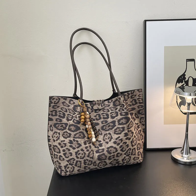 Leopard print polyester hand-held tote bag with double shoulder straps on a white background