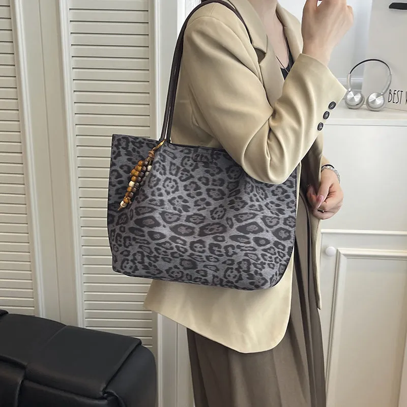 Leopard print polyester hand-held tote bag with double shoulder straps on a white background