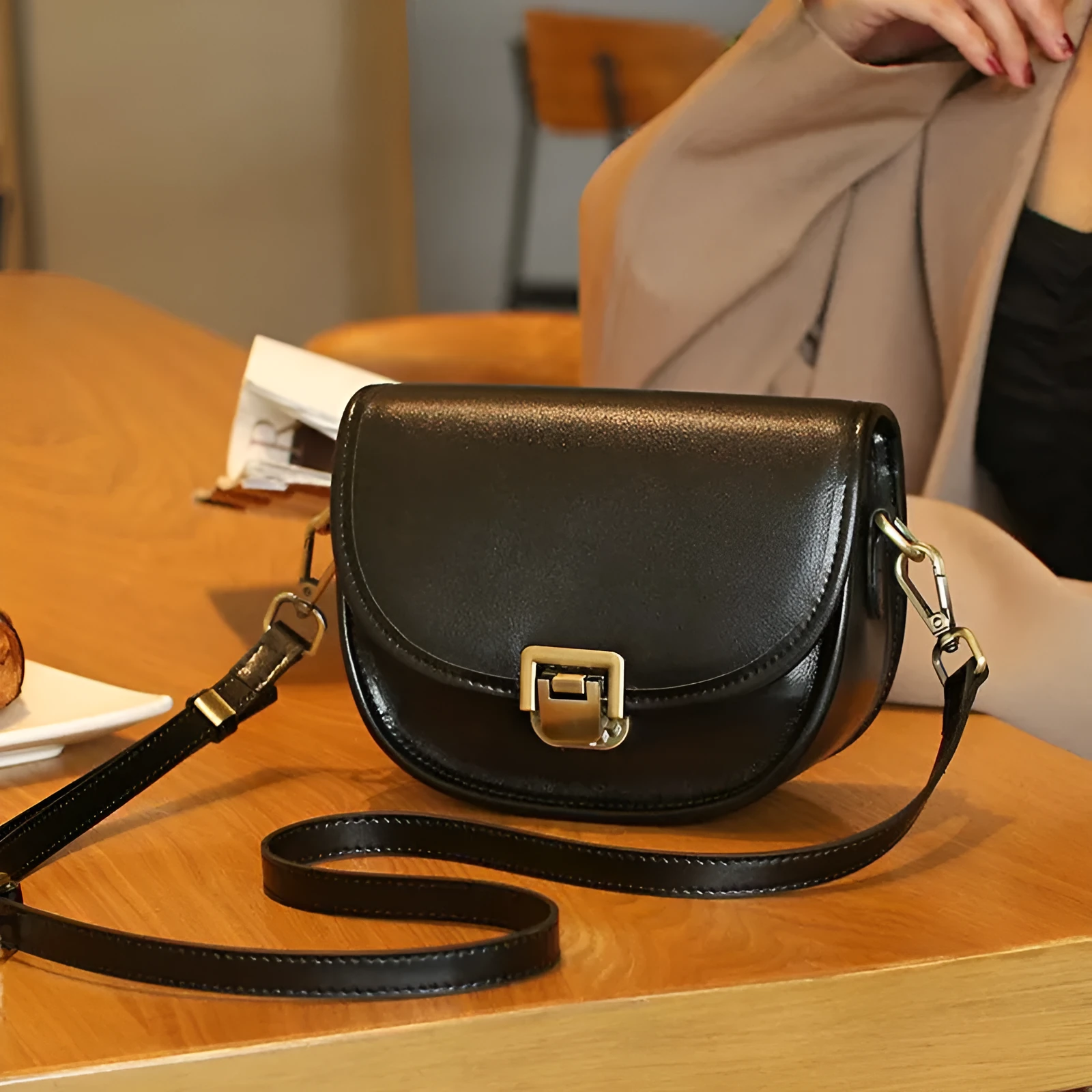 Vegetable tanned top layer cowhide half moon shoulder bag with lock detail, black colour, sandwich pocket, double straps