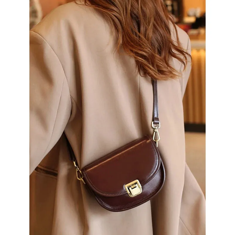 Vegetable tanned top layer cowhide half moon shoulder bag with lock detail, black colour, sandwich pocket, double straps