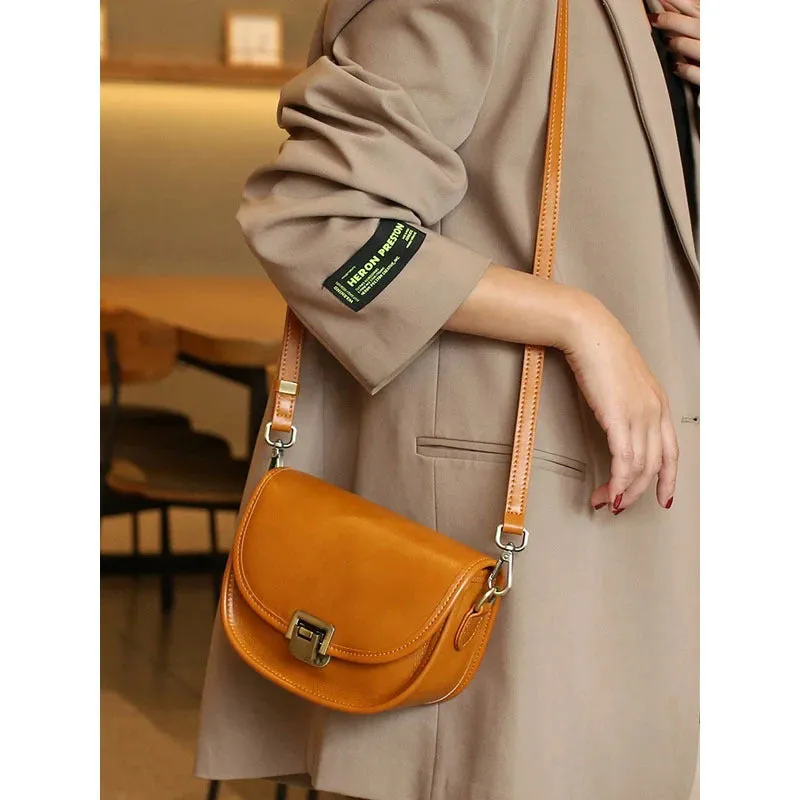 Vegetable tanned top layer cowhide half moon shoulder bag with lock detail, black colour, sandwich pocket, double straps