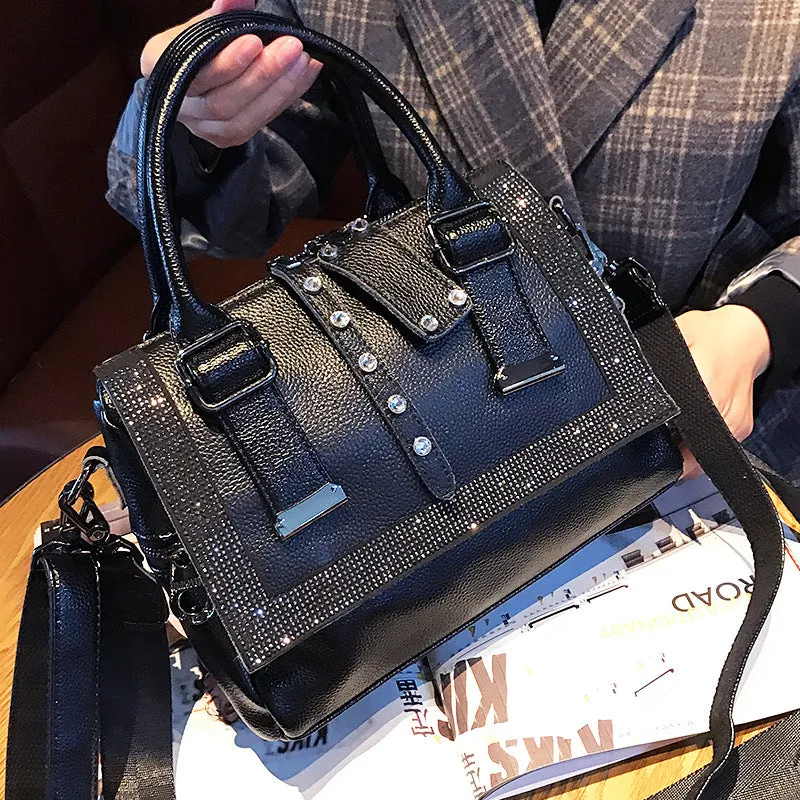 Large soft cowhide leather handbag in black with diamond decoration and lid closure