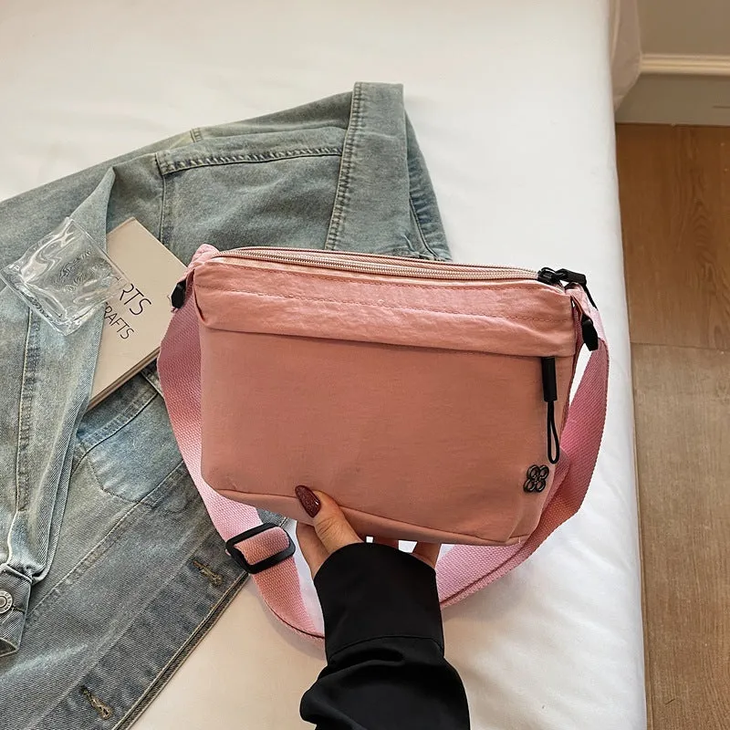 Soft cloth daily lightweight commuter crossbody bag in beige with sandwich pocket and sewn-thread detailing