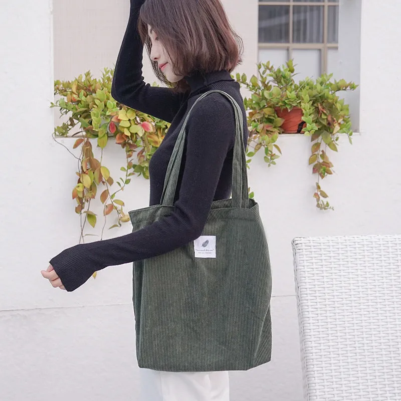 Women's corduroy shoulder bag in medium square vertical shape with soft handle, open top, available in black