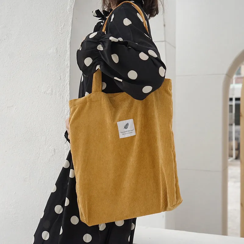 Women's corduroy shoulder bag in medium square vertical shape with soft handle, open top, available in black