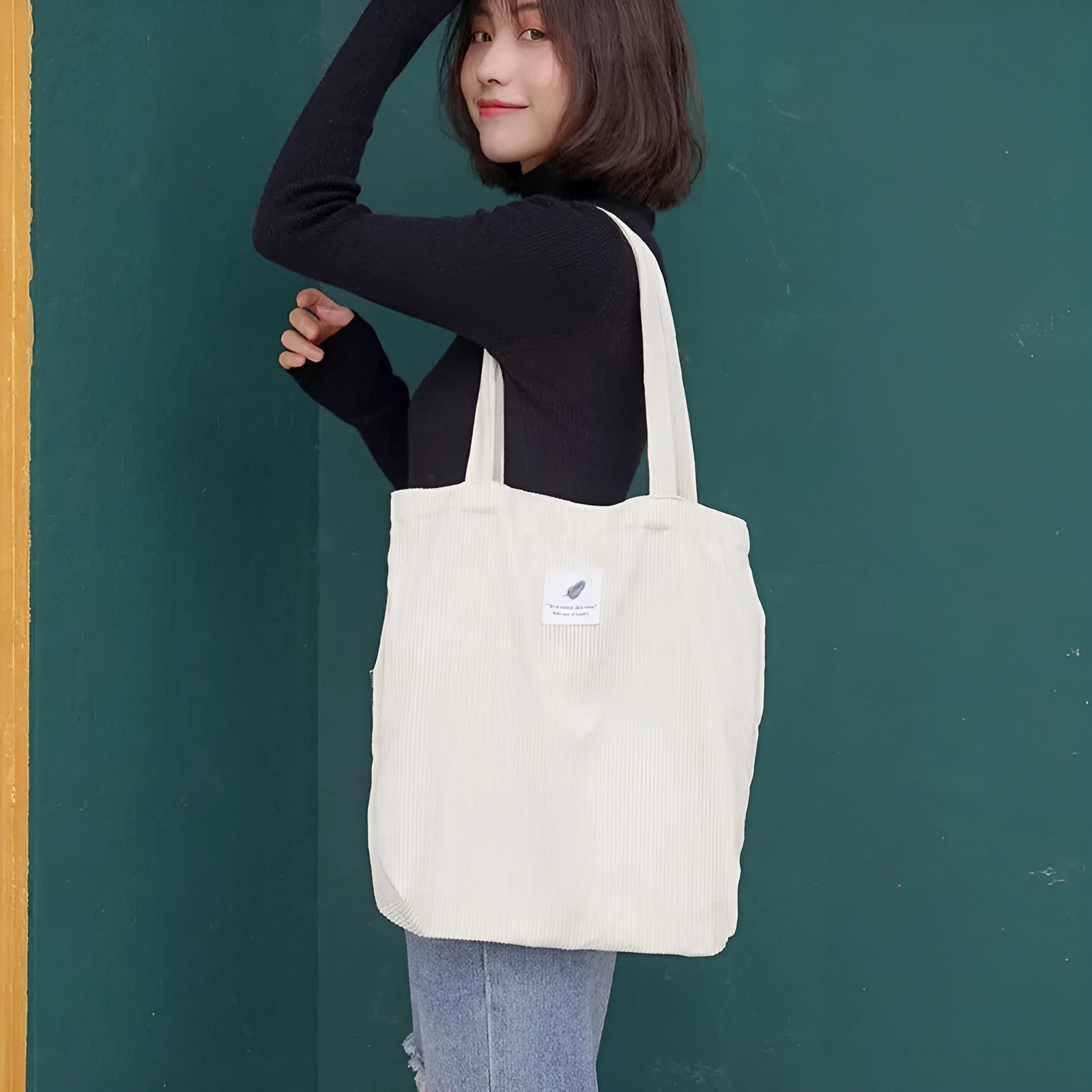 Women's corduroy shoulder bag in medium square vertical shape with soft handle, open top, available in black