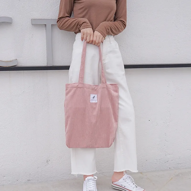Women's corduroy shoulder bag in medium square vertical shape with soft handle, open top, available in black