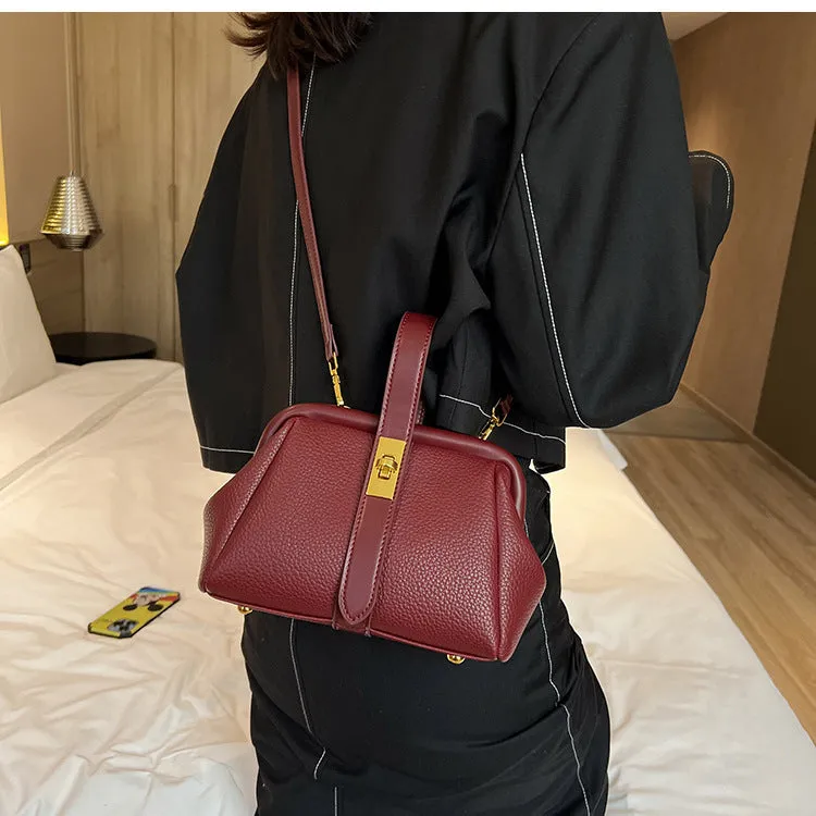 PU leather shoulder bag in cross-square shape with visible sewing line detail, available in four colours