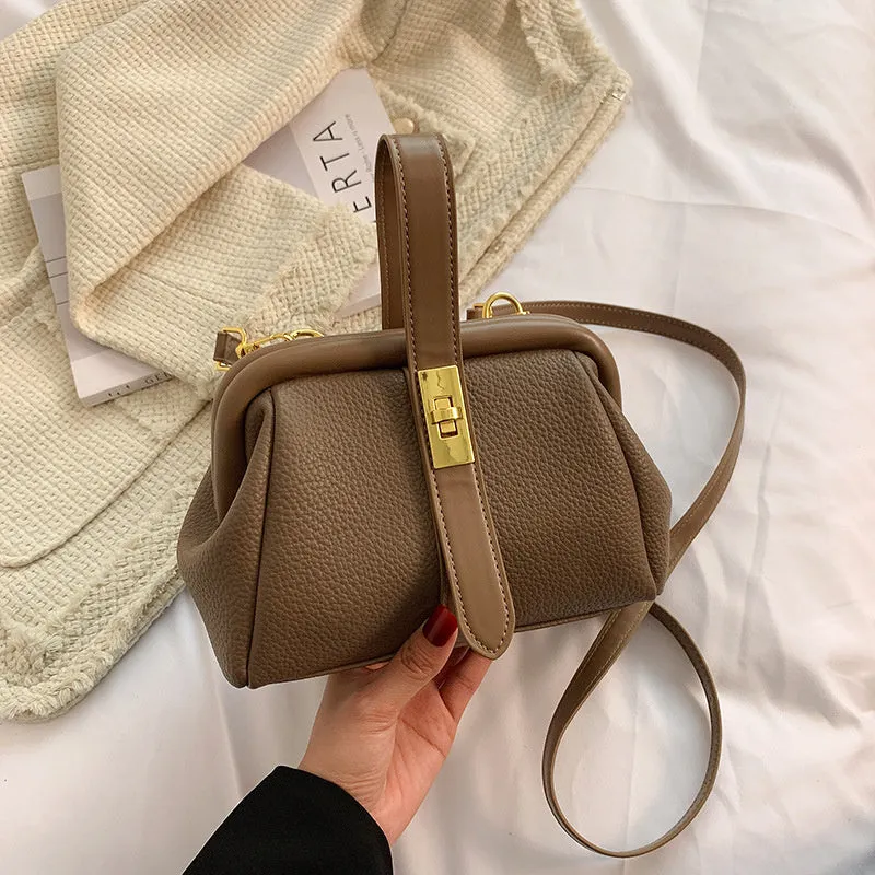 PU leather shoulder bag in cross-square shape with visible sewing line detail, available in four colours
