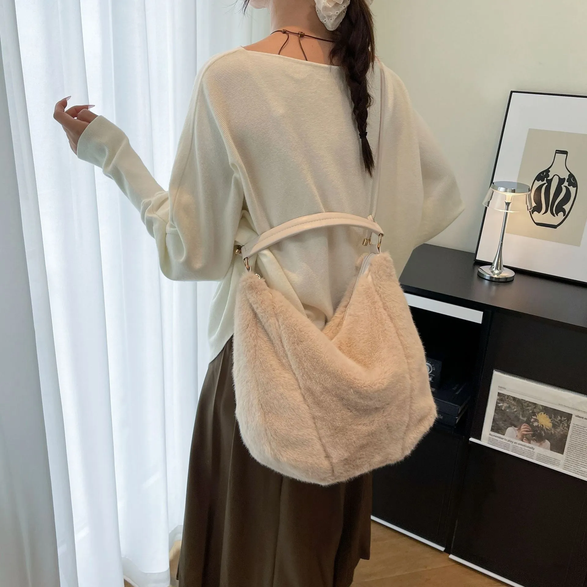 Beige one shoulder underarm bag in plush with splicing details, horizontal square shape, and single strap