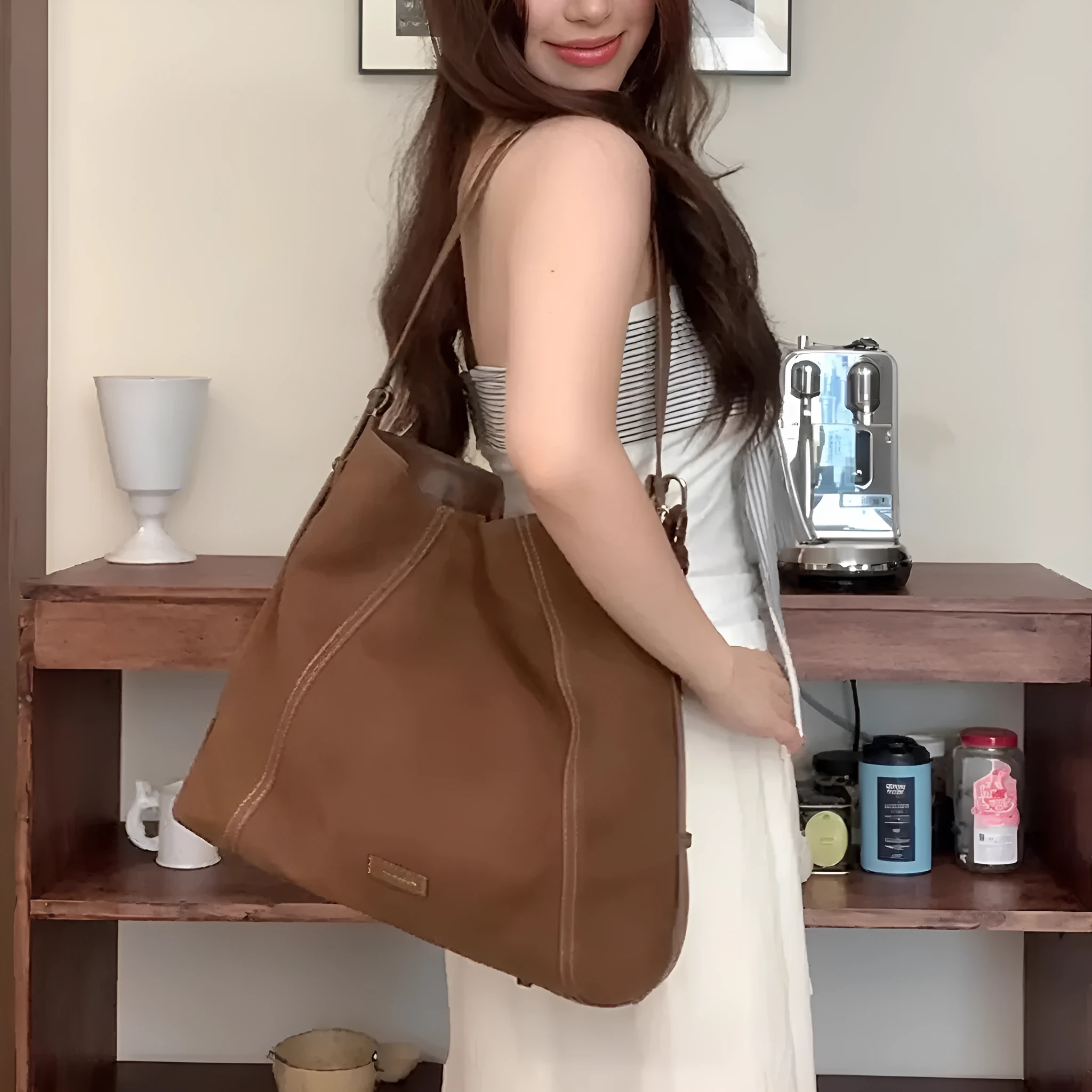 Large capacity soft suede messenger bag in coffee colour with single shoulder strap and sewing line detail