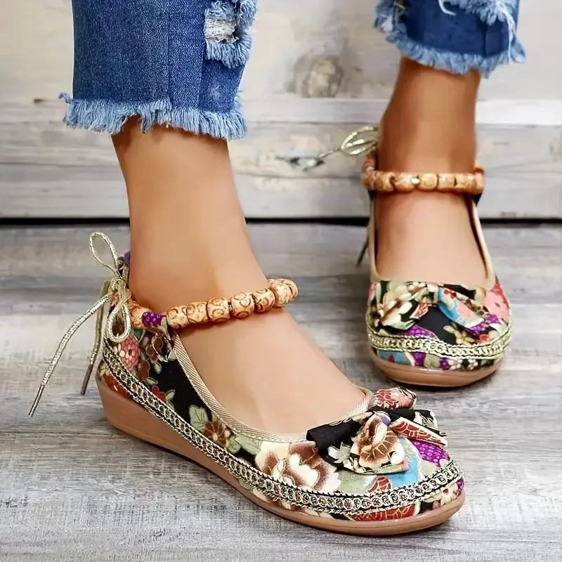 Women's plus size black ethnic platform sandals with cloth upper and elastic band, shown from the side.