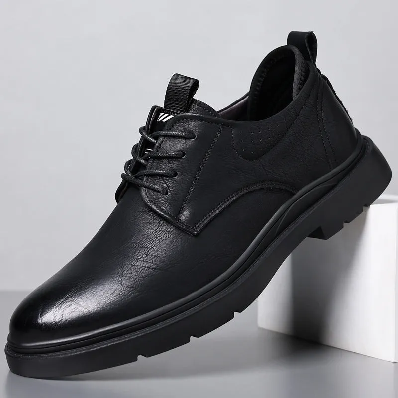 Men's black leather casual sneakers with sewing line detail and a rubber sole.