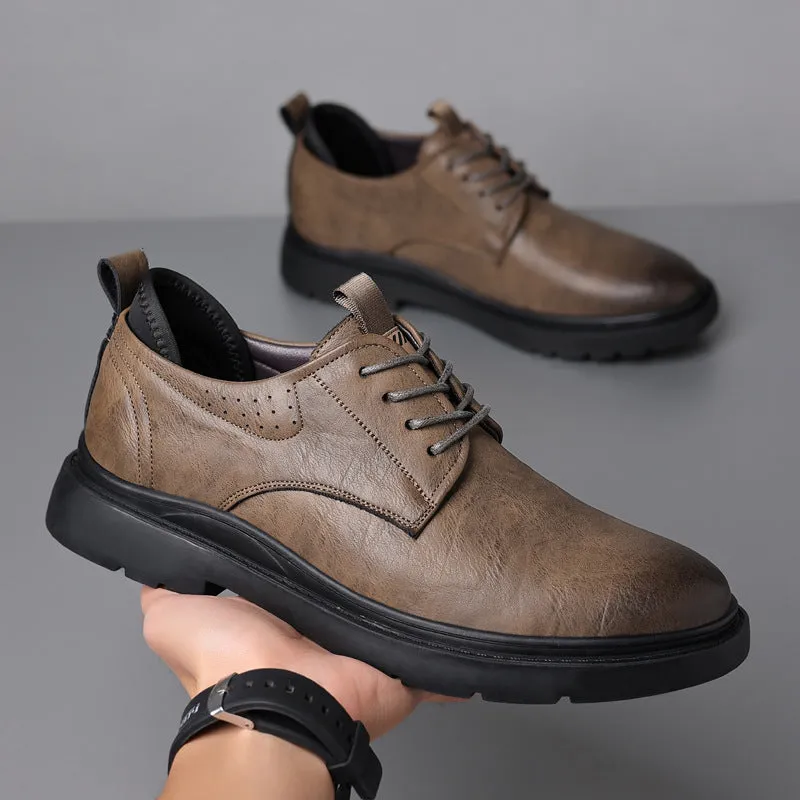 Men's black leather casual sneakers with sewing line detail and a rubber sole.