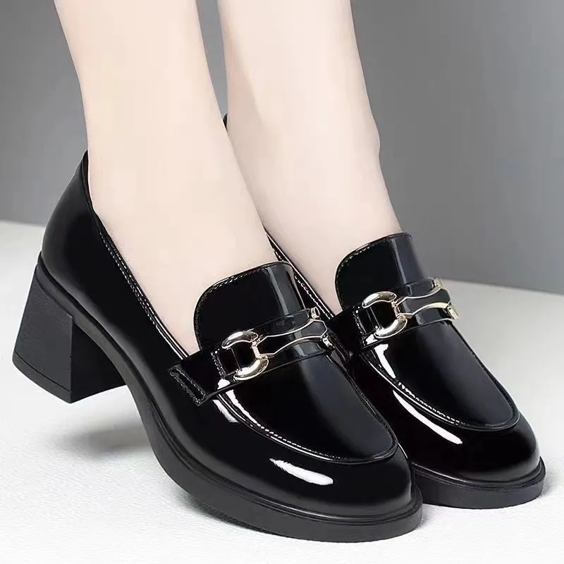 Dark green glossy chunky heel loafers for women with metal buckle and round toe on a white background