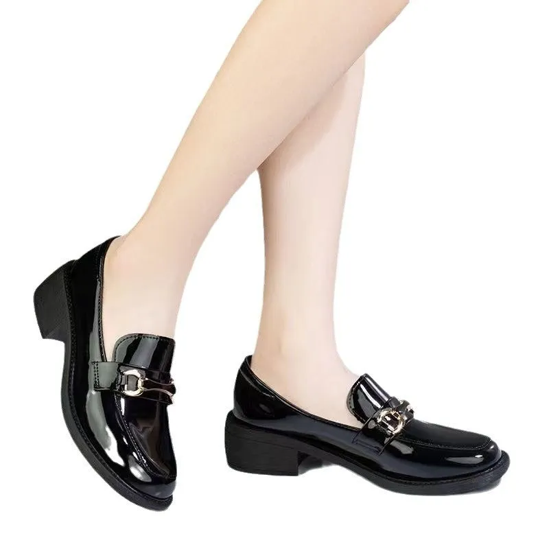 Dark green glossy chunky heel loafers for women with metal buckle and round toe on a white background