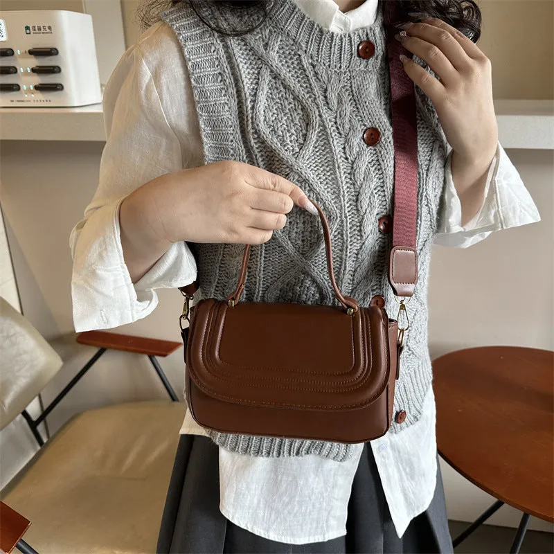 Women's casual PU one-shoulder crossbody bag in black with urban simplicity sewing line detail and sandwich pocket
