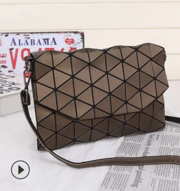 Rhombic ABS shoulder bag in envelope style, available in multiple colours including black and pink.