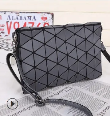 Rhombic ABS shoulder bag in envelope style, available in multiple colours including black and pink.