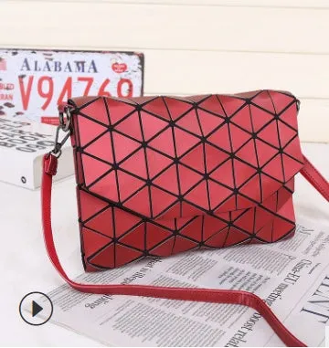 Rhombic ABS shoulder bag in envelope style, available in multiple colours including black and pink.