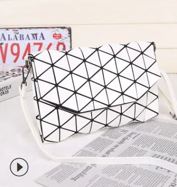 Rhombic ABS shoulder bag in envelope style, available in multiple colours including black and pink.
