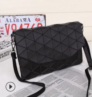 Rhombic ABS shoulder bag in envelope style, available in multiple colours including black and pink.