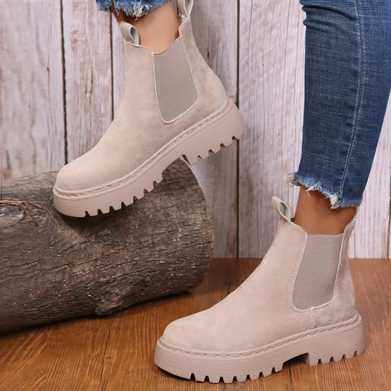 Women's Martin boots in solid colour with chunky platform sole, flat heel, and leather stitching