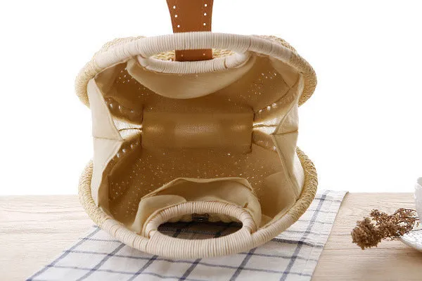 Women's round woven paper rope handbag in beige with hard shell, cover closure, and hard handle