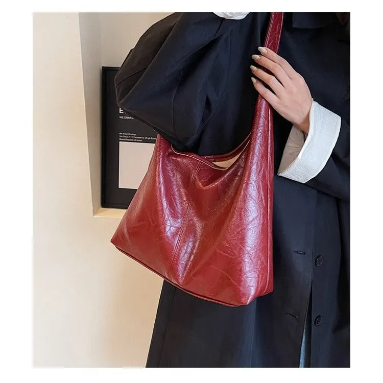 Women's large capacity PU shoulder tote bag in brown with sewing line detail and single strap