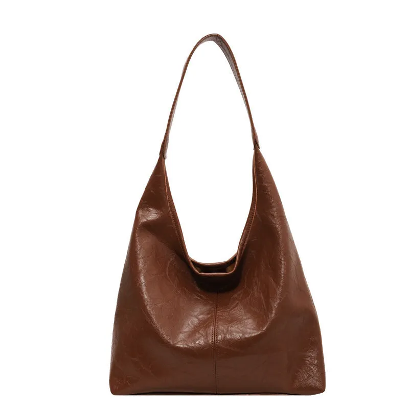 Women's large capacity PU shoulder tote bag in brown with sewing line detail and single strap