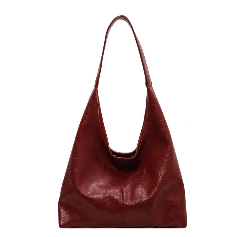 Women's large capacity PU shoulder tote bag in brown with sewing line detail and single strap
