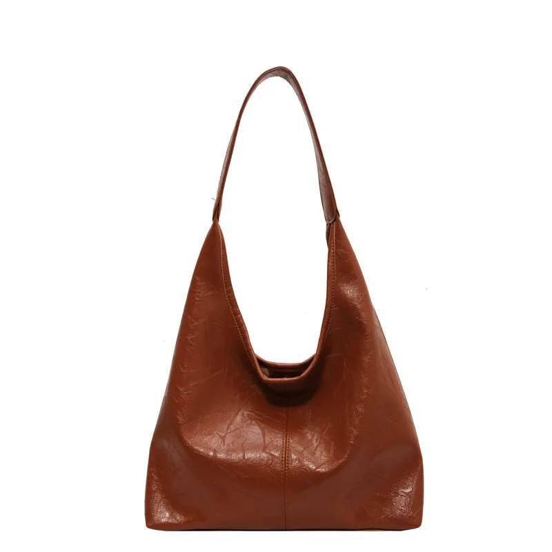 Women's large capacity PU shoulder tote bag in brown with sewing line detail and single strap