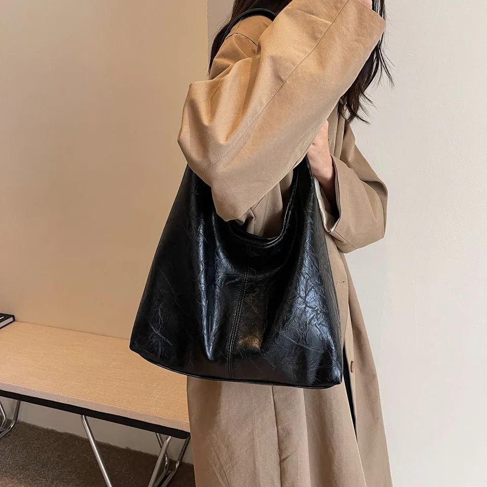 Women's large capacity PU shoulder tote bag in brown with sewing line detail and single strap