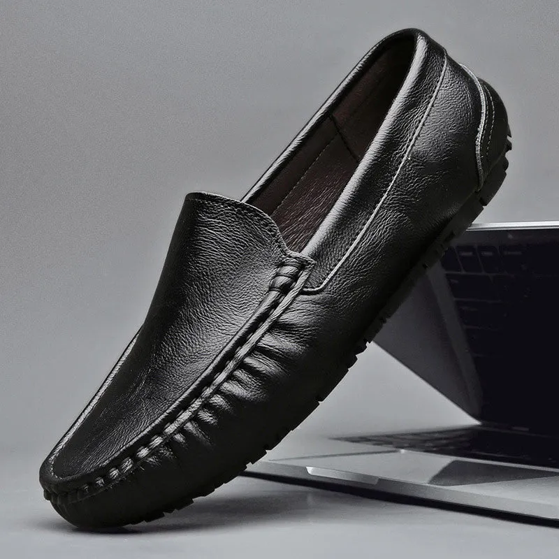 Mens brown casual driving shoes with leather upper, round toe, and stitching detail on a white background