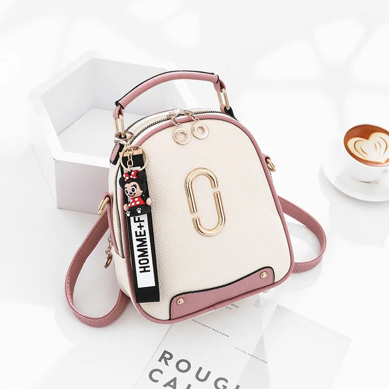 Fashion backpack for women in PU leather oval shape with double shoulder straps and car suture detail
