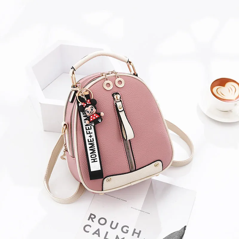 Fashion backpack for women in PU leather oval shape with double shoulder straps and car suture detail