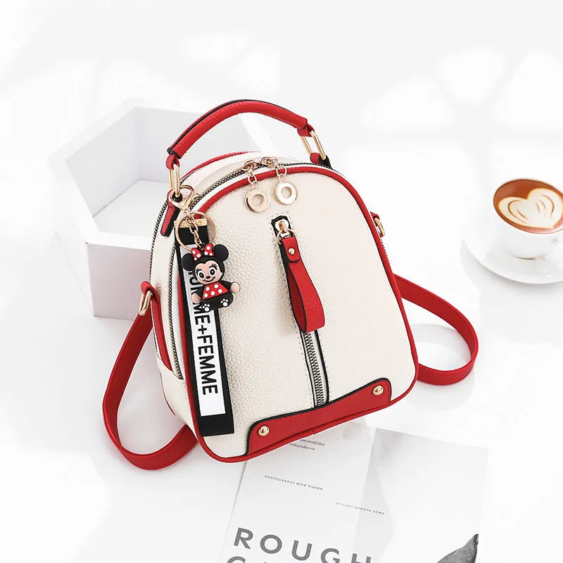 Fashion backpack for women in PU leather oval shape with double shoulder straps and car suture detail
