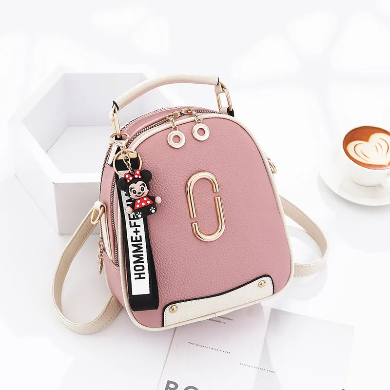 Fashion backpack for women in PU leather oval shape with double shoulder straps and car suture detail